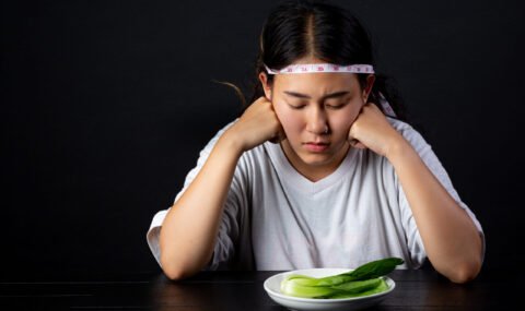 Depressed woman hungry from dieting