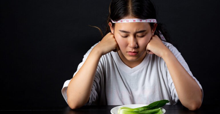 Depressed woman hungry from dieting