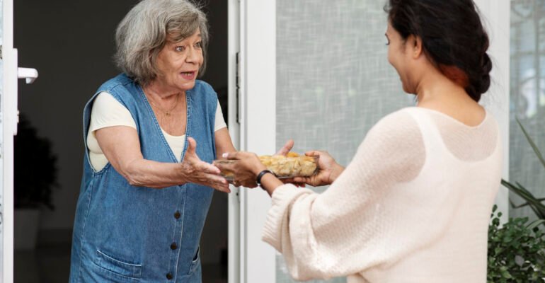 woman-offering-food-neighbor